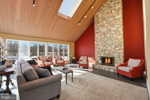 a lobby with furniture and floor to ceiling window