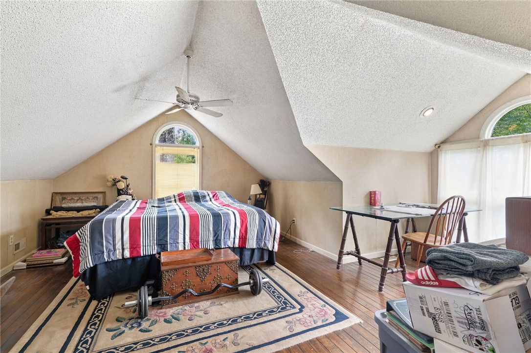 133 Pinetree Lane Easley, SC 29640 - Photo 2 of 28 Hardwood floors and vaulted ceilings define this versatile upstairs bedroom space.
