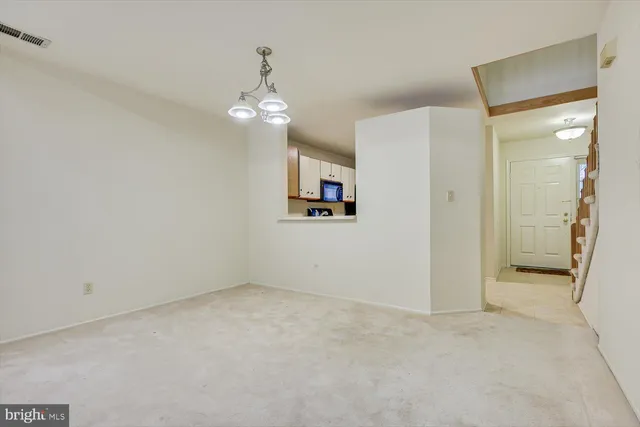 a kitchen with stainless steel appliances granite countertop a refrigerator stove and sink