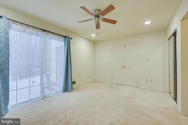 a view of a livingroom with a ceiling fan