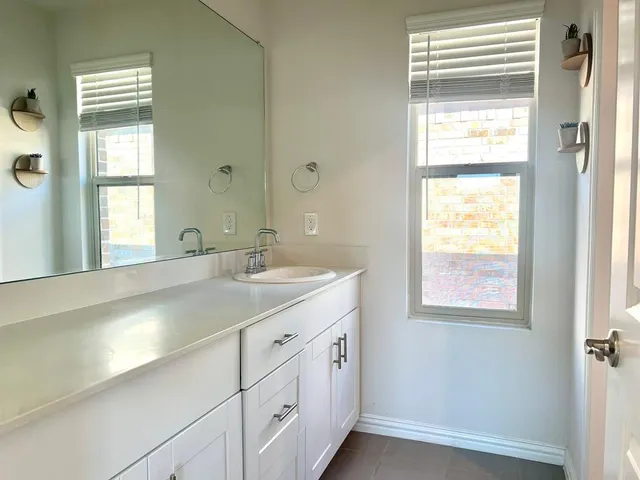 an empty room with a empty space and a window