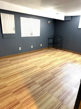 a view of an empty room and a window