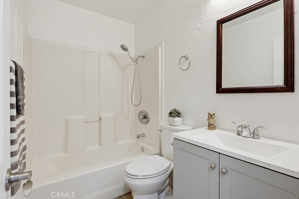 1104 Williamson Avenue Fullerton, CA 92833 - Photo 16 of 19 a bathroom with a toilet sink vanity tub and shower