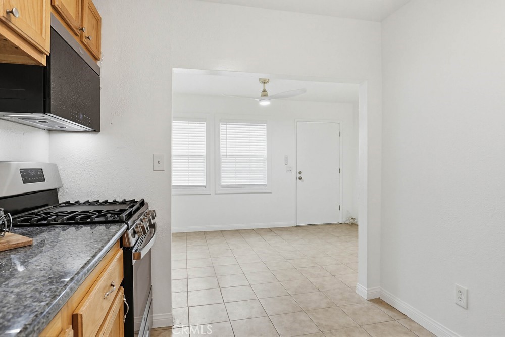 1104 Williamson Avenue Fullerton, CA 92833 - Photo 9 of 19 a kitchen that has a microwave and a stove