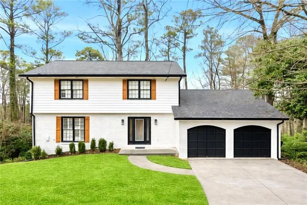 front view of a house with a yard