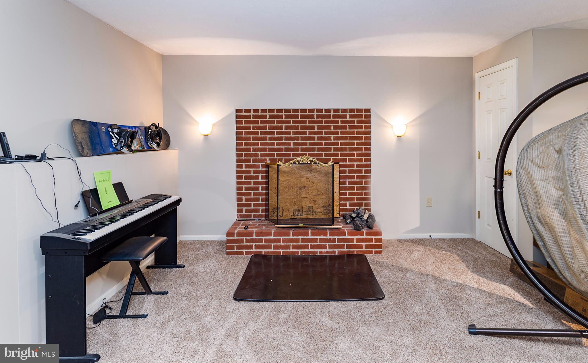 158 Ranger Court Front Royal, VA 22630 - Photo 25 of 30 Brick wood burning fireplace in basement