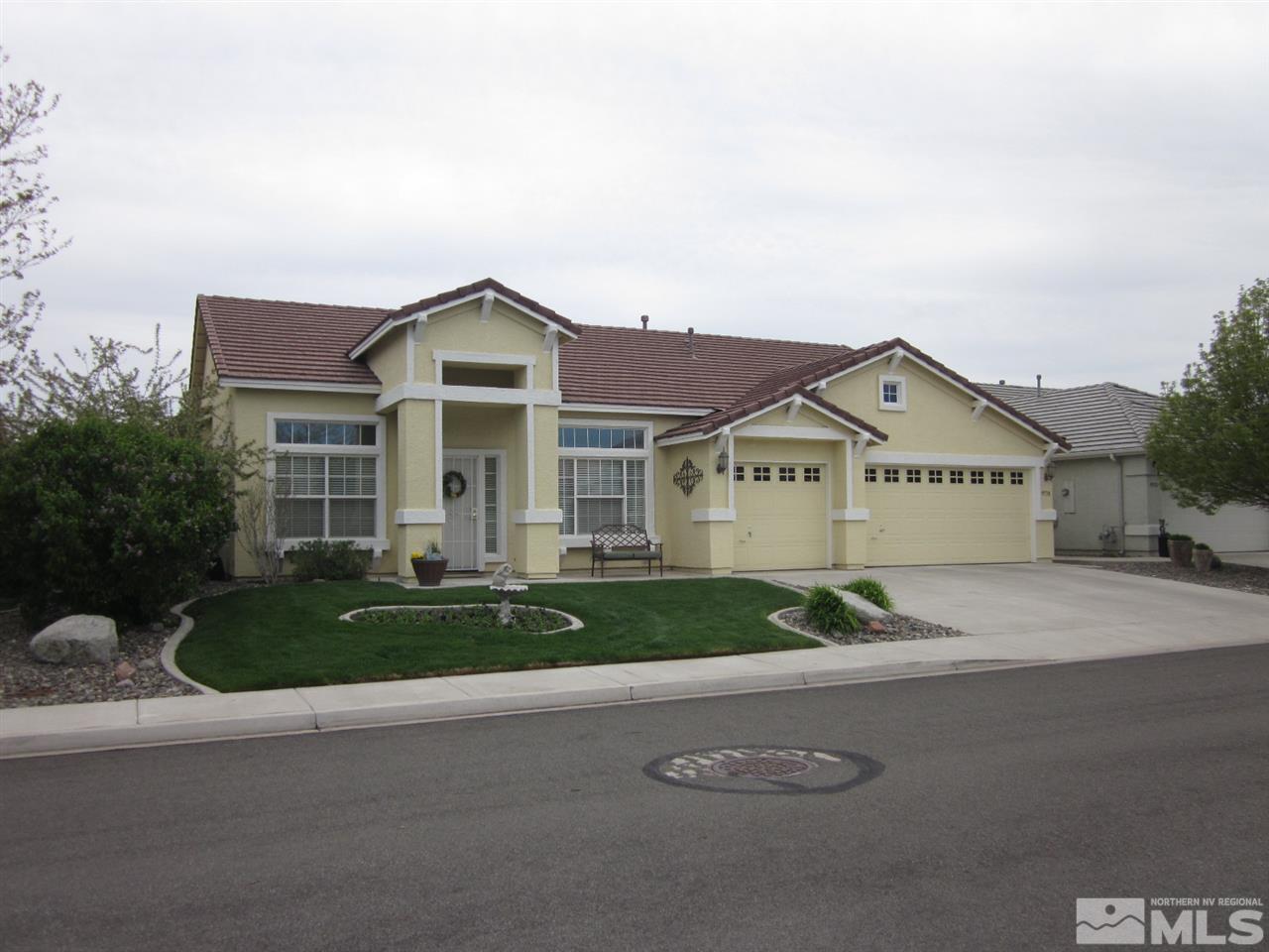 9538 Mammoth Court Reno, NV 89521 - Photo 1 of 1 a front view of a house with a garden and garage