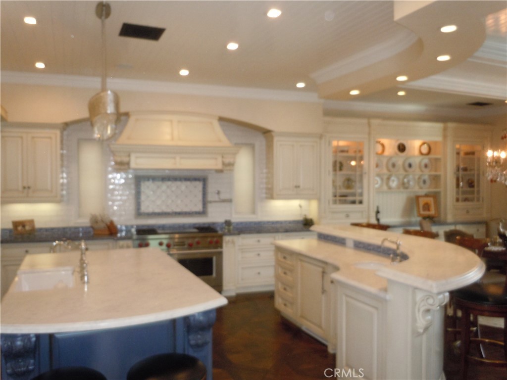 59 Rivo Alto Canal Long Beach, CA 90803 - Photo 25 of 47 a kitchen with a sink a stove and chairs