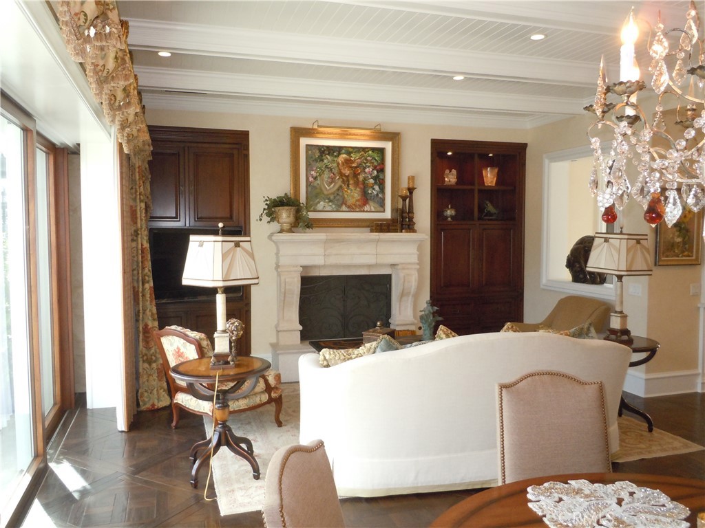 59 Rivo Alto Canal Long Beach, CA 90803 - Photo 28 of 47 a living room with furniture a fireplace and a chandelier