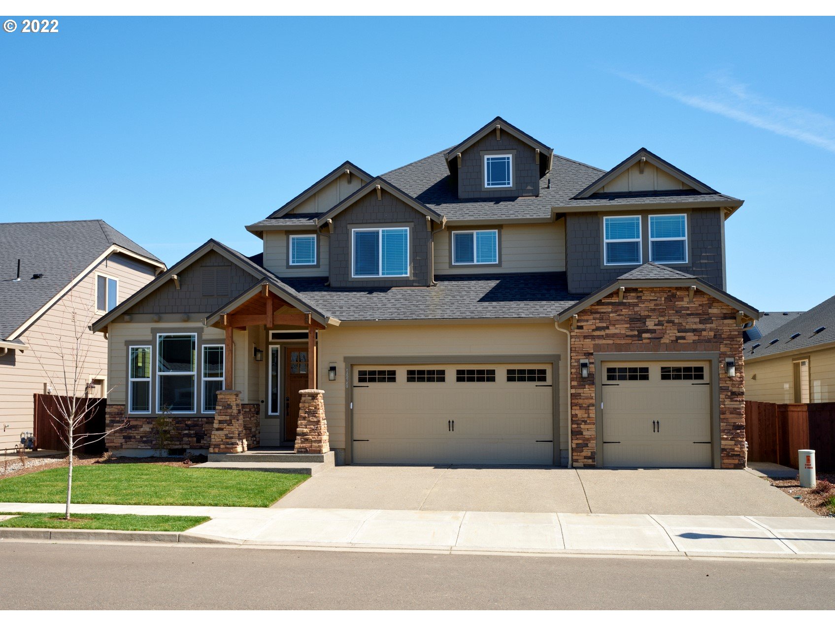 1638 South 46th Place Ridgefield, WA 98642 - Photo 1 of 29 a front view of a house with a yard and garage