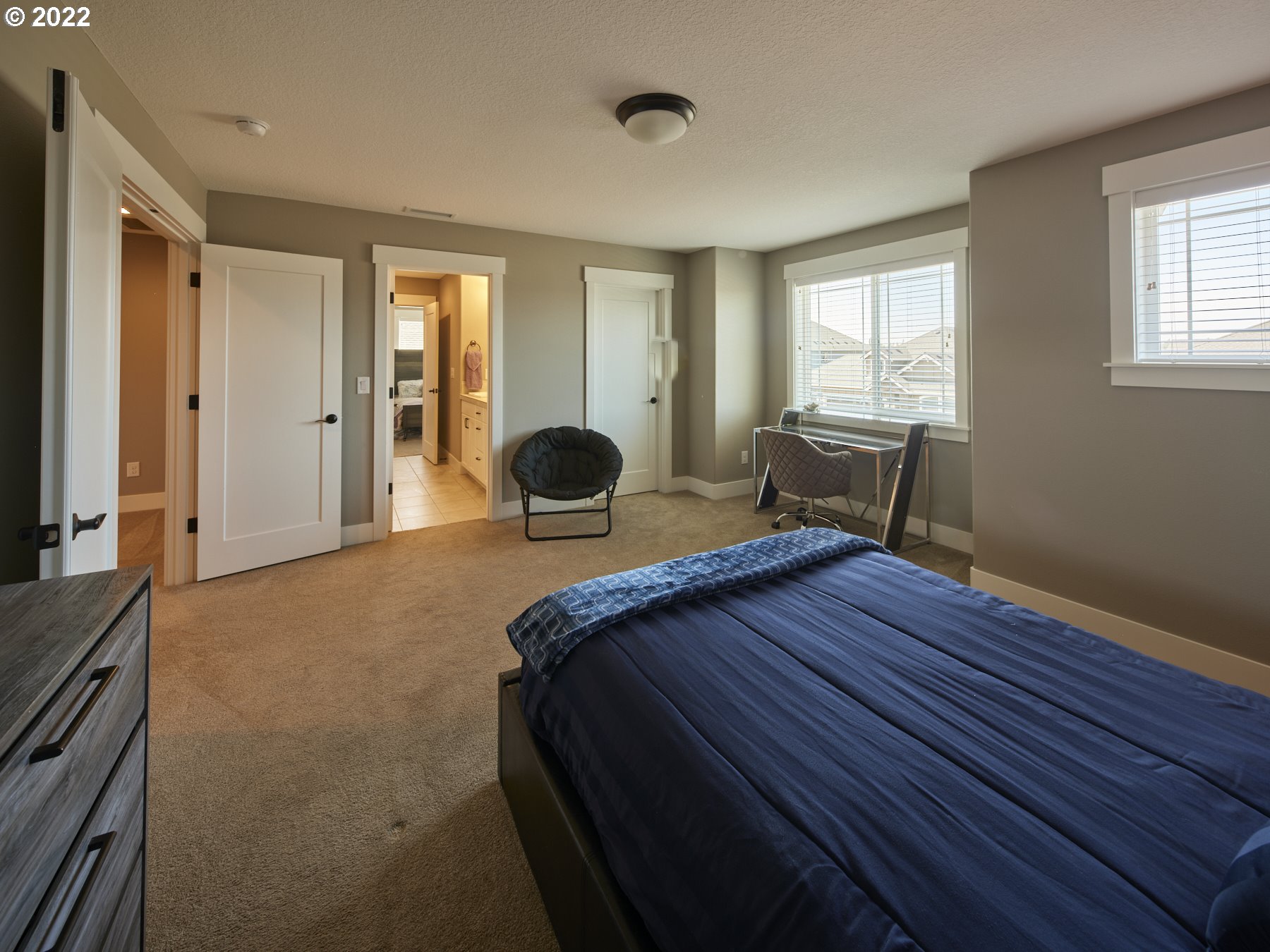 1638 South 46th Place Ridgefield, WA 98642 - Photo 17 of 29 a bedroom with a bed and a chair