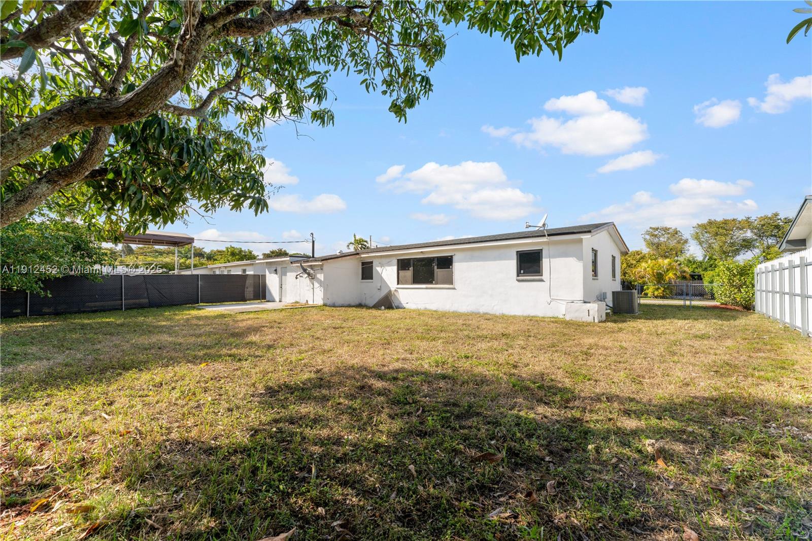 11532 Southwest 136th Terrace Miami, FL 33176 - Photo 8 of 20 a house view with a garden space