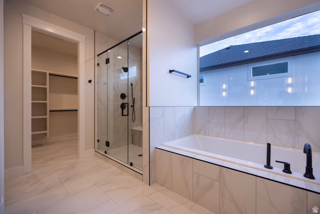 904 South 1900 West Layton, UT 84041 - Photo 14 of 19 Master Bathroom featuring a dual shower head shower, a seperate bath, and a walk in closet