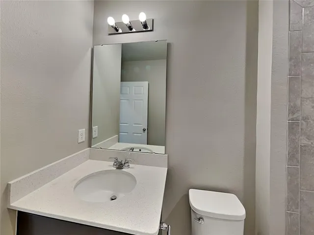 a bathroom with a sink and a toilet