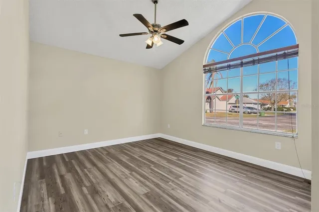 wooden floor in a room next to a window