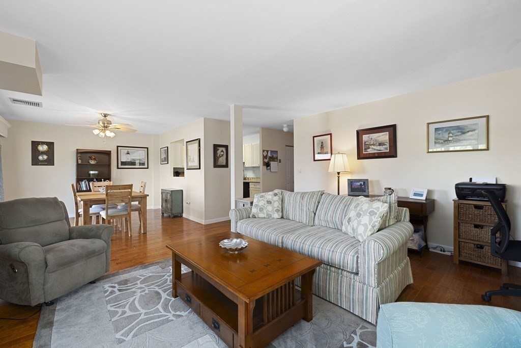 45 Main Street, Unit 111 Wareham, MA 02571 - Photo 11 of 20 a living room with furniture dining table and a couch