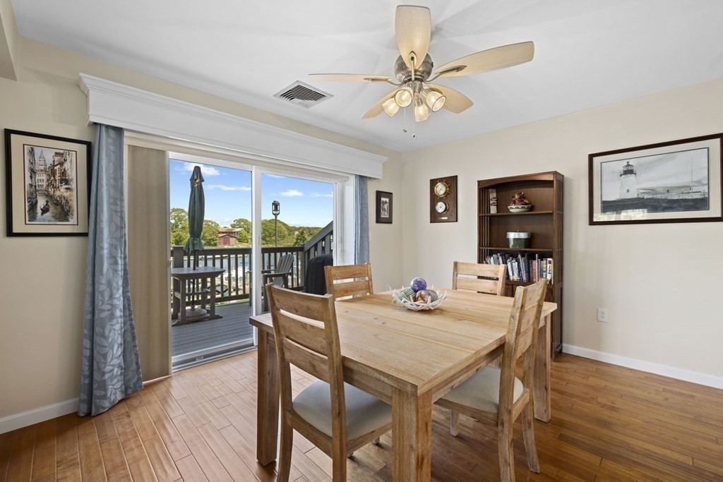 45 Main Street, Unit 111 Wareham, MA 02571 - Photo 12 of 20 a view of a dining room with furniture window and wooden floor