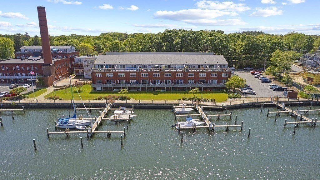 45 Main Street, Unit 111 Wareham, MA 02571 - Photo 19 of 20 a view of swimming pool with outdoor seating space