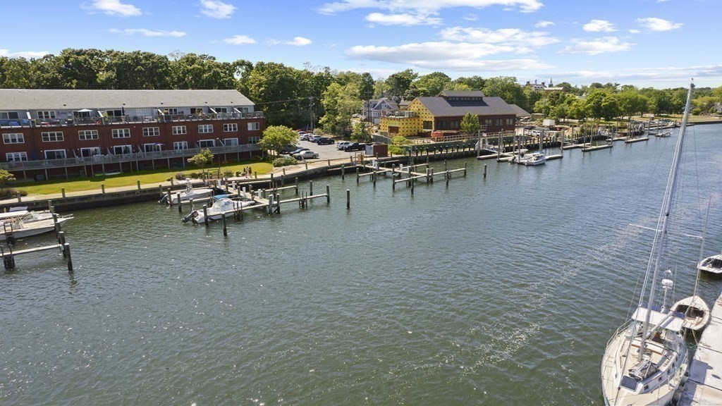 45 Main Street, Unit 111 Wareham, MA 02571 - Photo 20 of 20 a view of a lake with a table and chairs