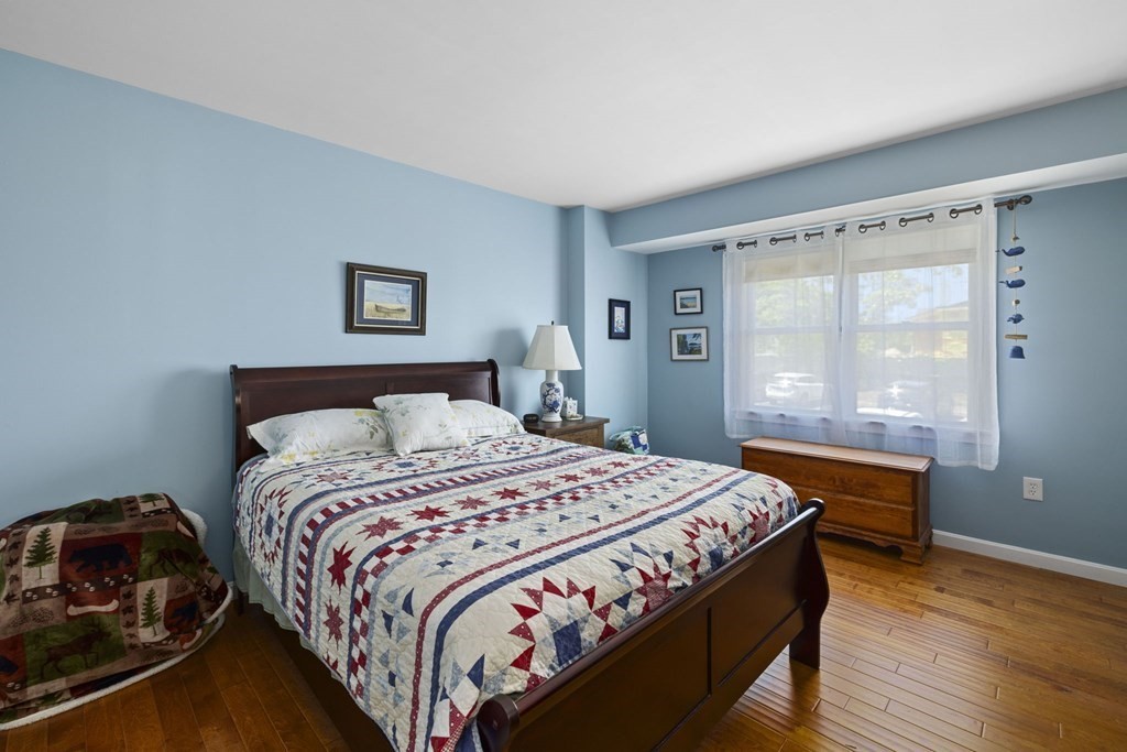 45 Main Street, Unit 111 Wareham, MA 02571 - Photo 5 of 20 a bedroom with a bed and a window