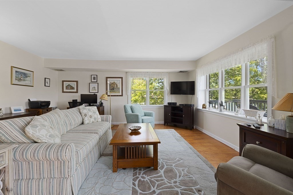 45 Main Street, Unit 111 Wareham, MA 02571 - Photo 10 of 20 a living room with furniture and a flat screen tv