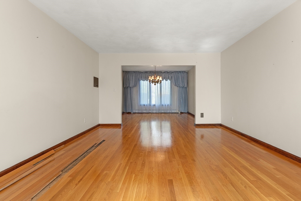 34 Coolidge Road Winchester, MA 01890 - Photo 13 of 33 a view of empty room with wooden floor and fan