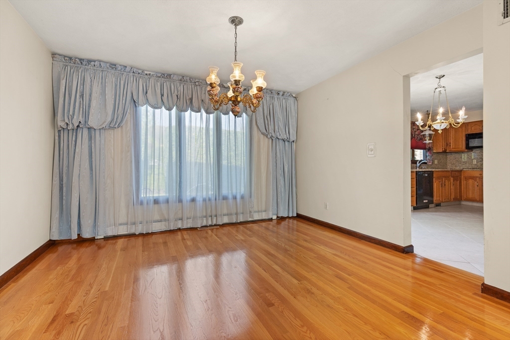 34 Coolidge Road Winchester, MA 01890 - Photo 16 of 33 a view of livingroom with hardwood floor and window
