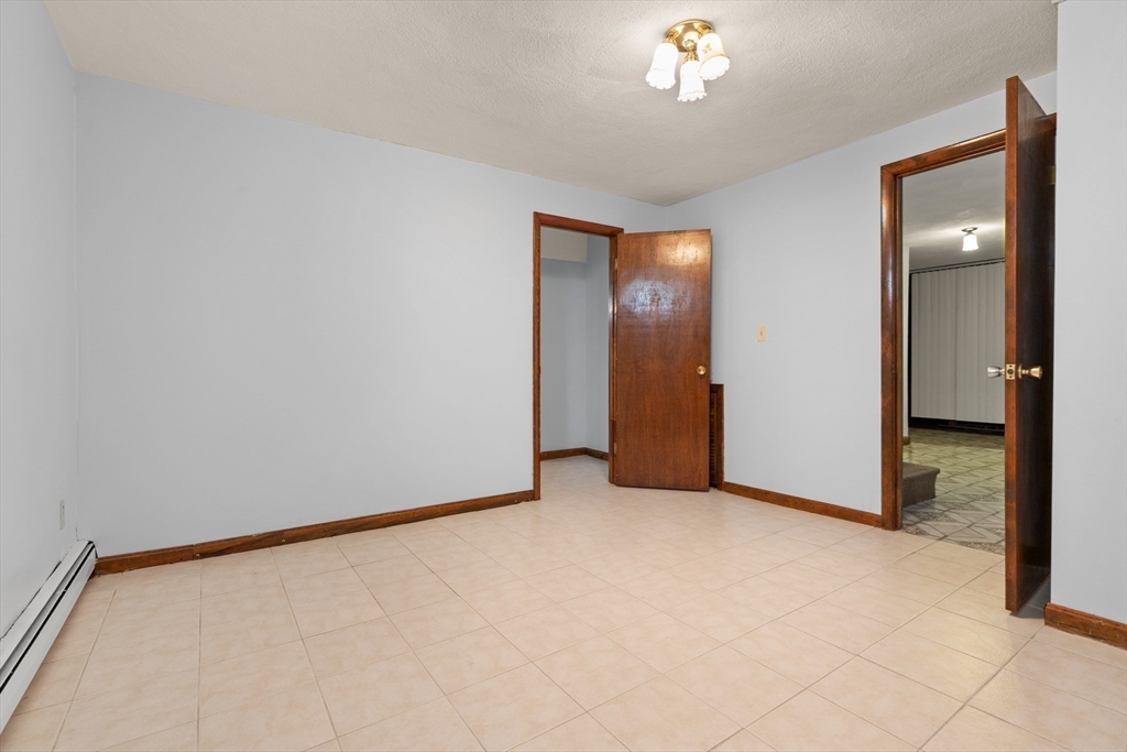 34 Coolidge Road Winchester, MA 01890 - Photo 17 of 33 a view of an empty room with a window