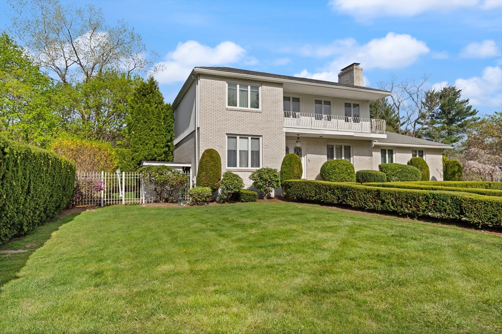 34 Coolidge Road Winchester, MA 01890 - Photo 2 of 33 a front view of a house with a garden