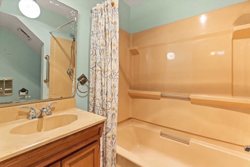 34 Coolidge Road Winchester, MA 01890 - Photo 26 of 33 a bathroom with a sink and a bathtub