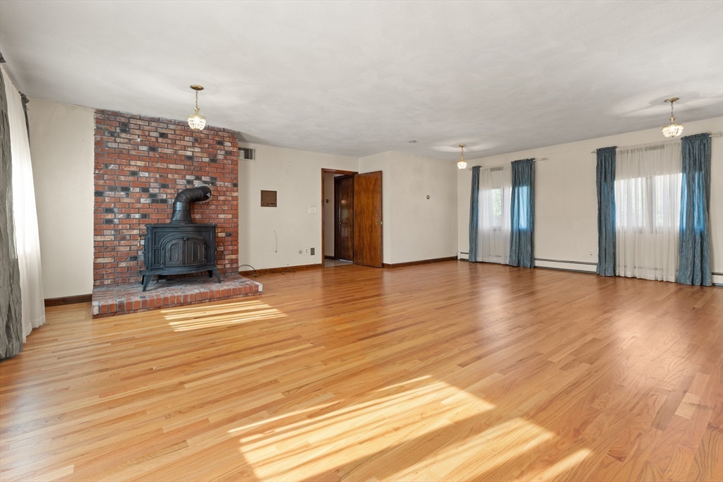 34 Coolidge Road Winchester, MA 01890 - Photo 8 of 33 a view of a livingroom with wooden floor and furniture
