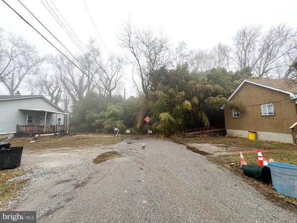 a view of a street with a parked car
