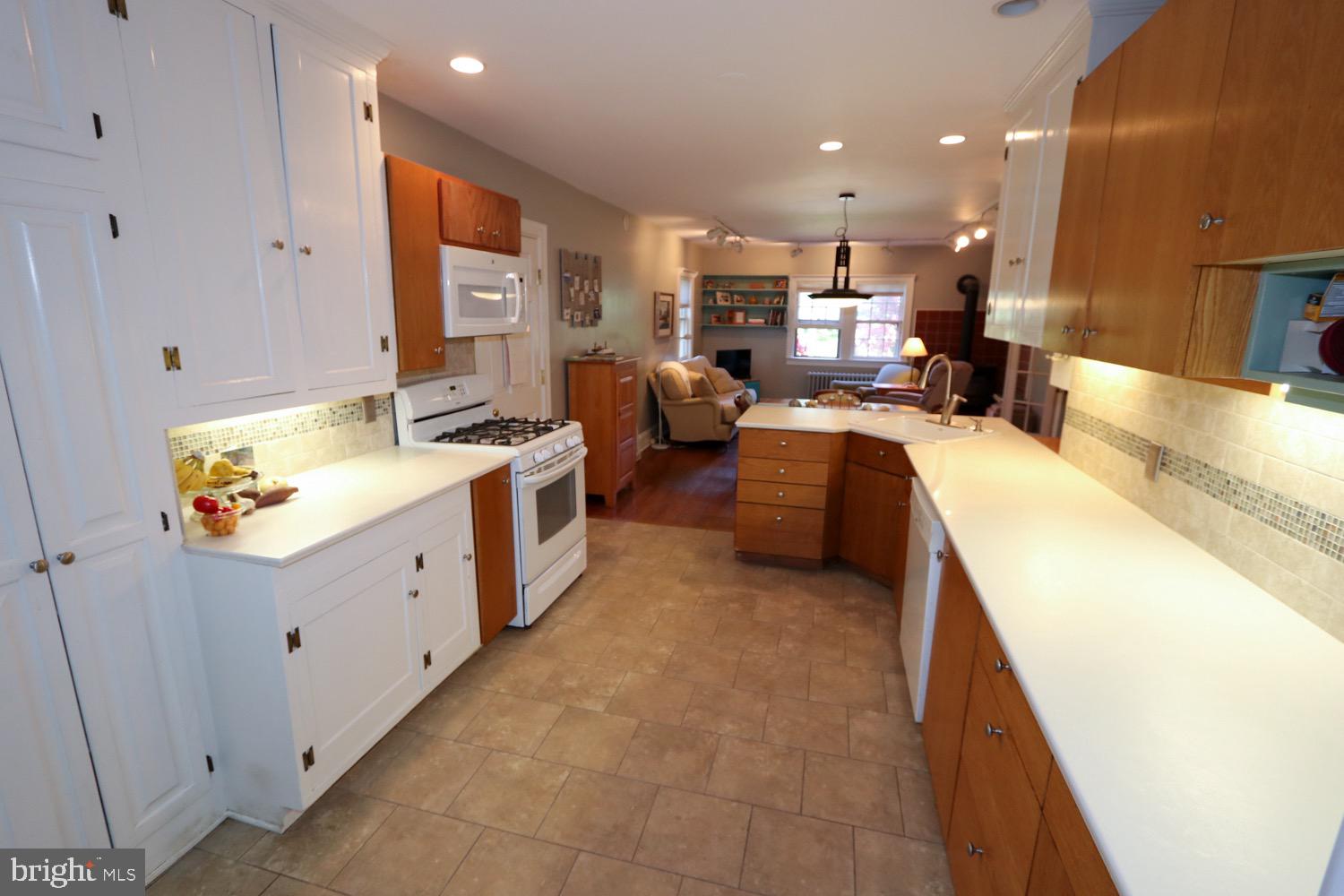 2701 Alden Road Bryn Athyn, PA 19006 - Photo 25 of 105 a large white room with stainless steel appliances kitchen island granite countertop a sink and cabinets