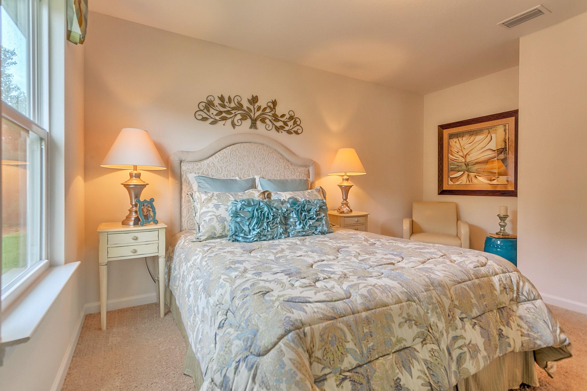 334 Merlin Court Crestview, FL 32539 - Photo 11 of 19 a bedroom with a bed and a painting on the wall