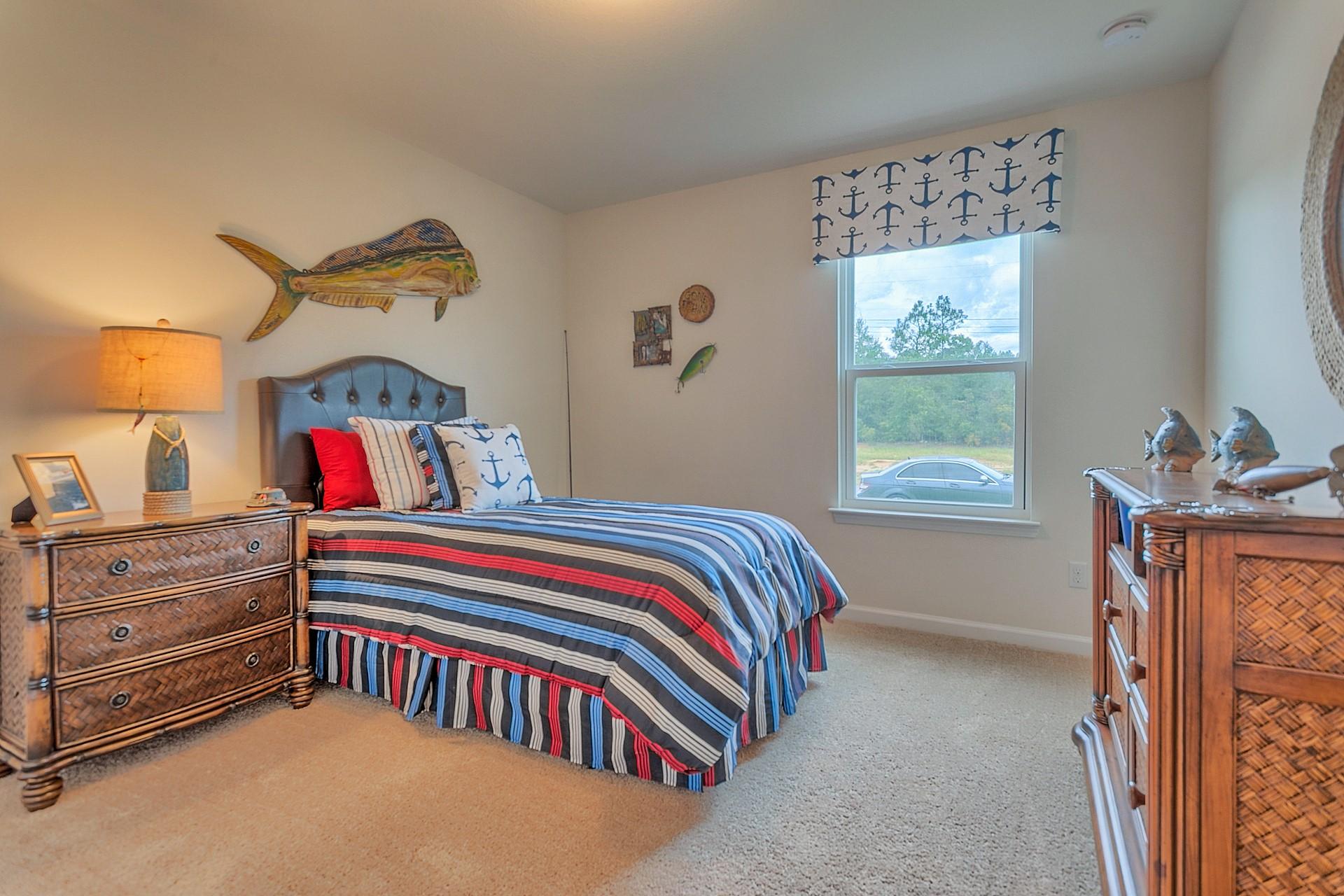 334 Merlin Court Crestview, FL 32539 - Photo 12 of 19 a bedroom with a bed and a window