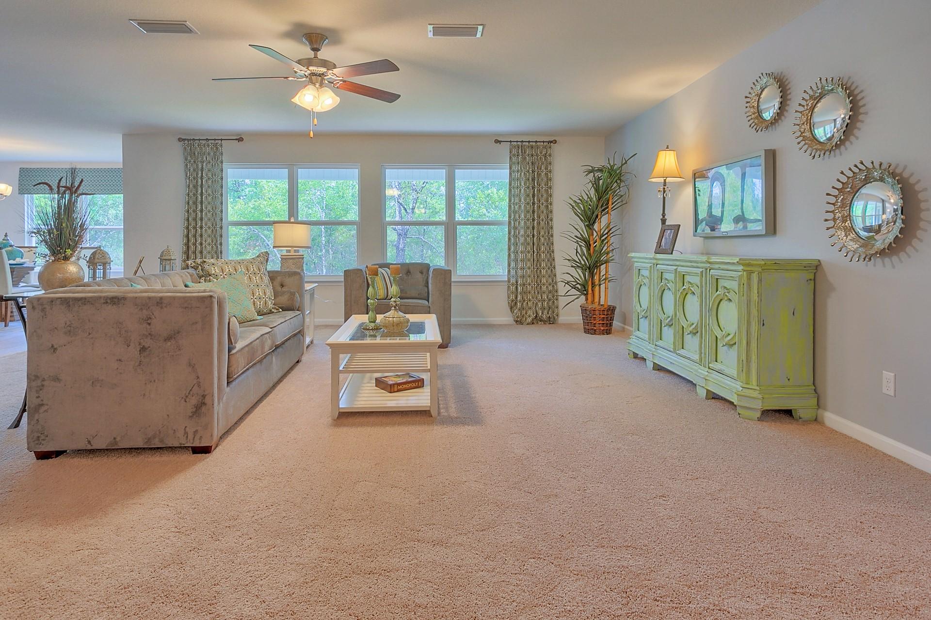 334 Merlin Court Crestview, FL 32539 - Photo 7 of 19 a living room with furniture and a large window