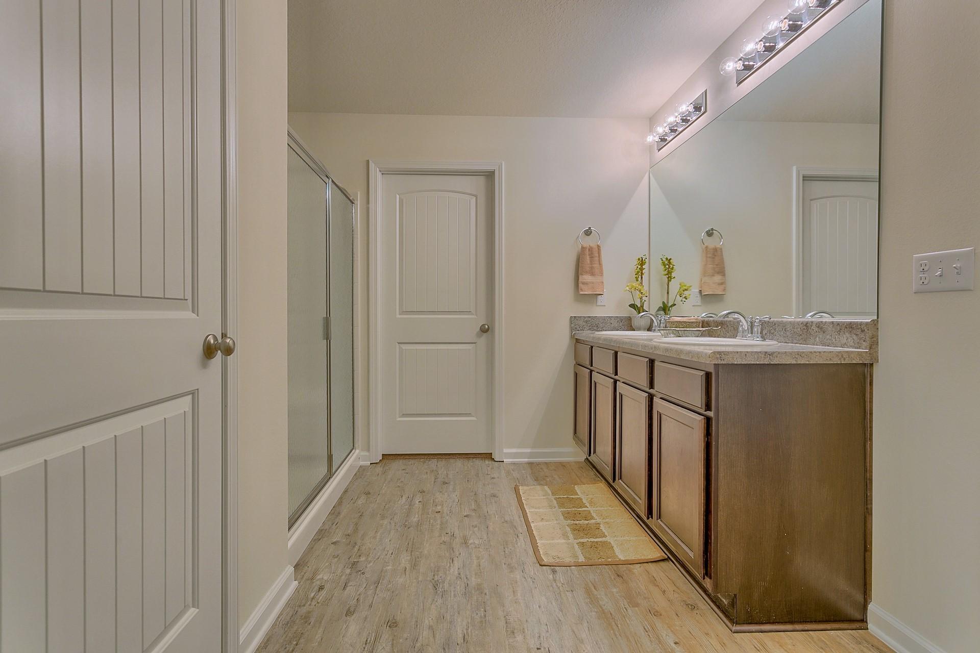 334 Merlin Court Crestview, FL 32539 - Photo 9 of 19 a bathroom with a sink and a mirror