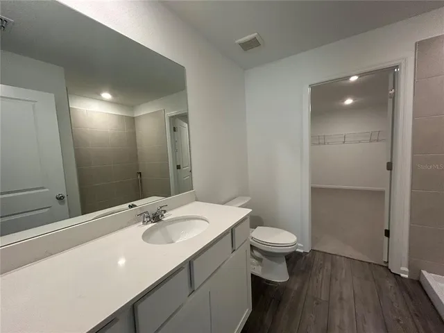 a bathroom with a tub and a shower