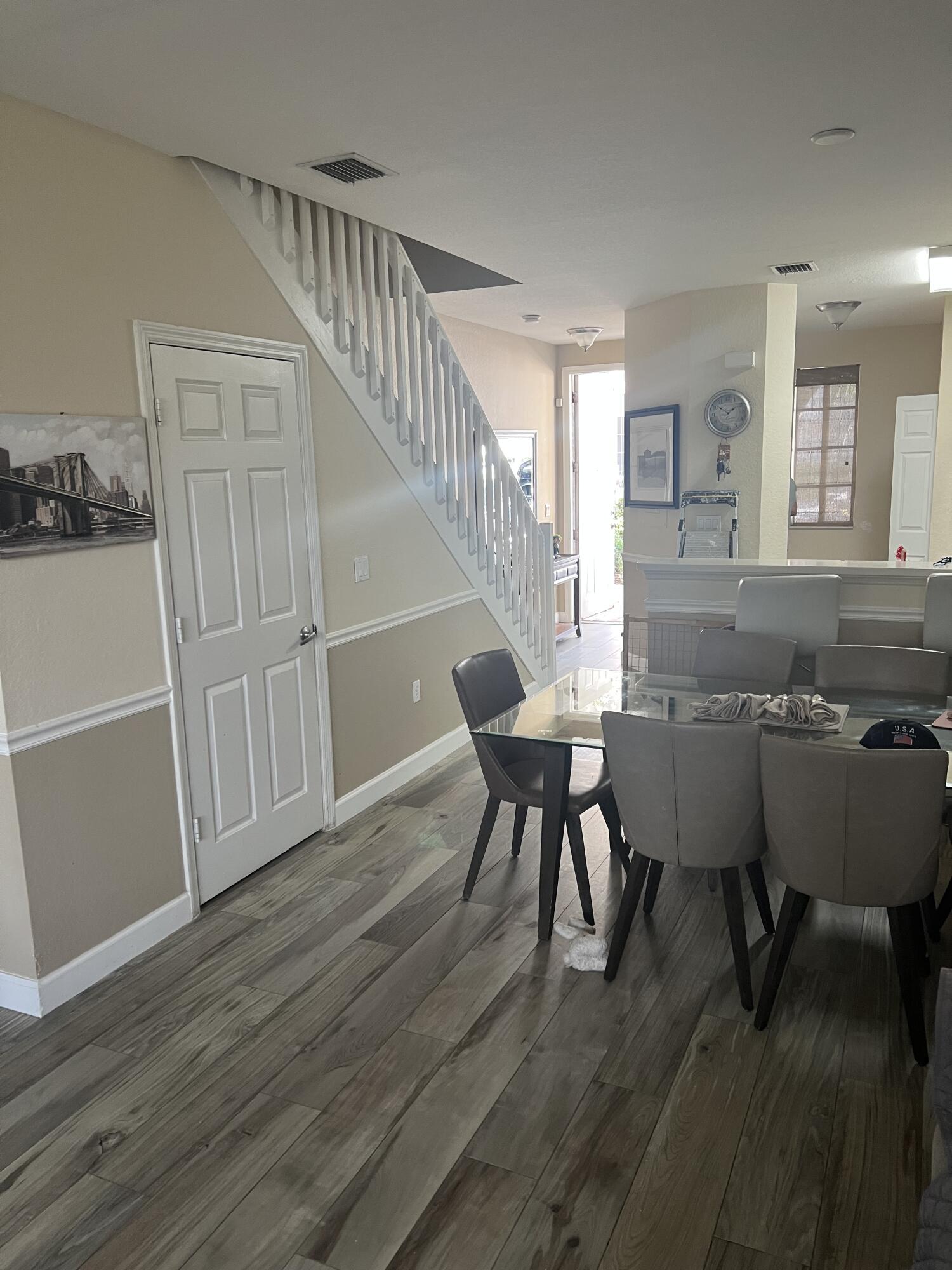 4110 Napoli Lake Drive Riviera Beach, FL 33410 - Photo 8 of 17 Half bath under stairs 4110