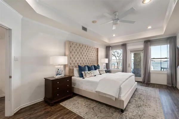 a bedroom with a large bed and a window