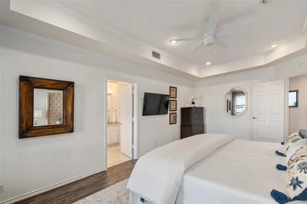 a bedroom with a bed and a television