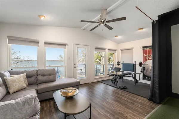 a living room with furniture and wooden floor