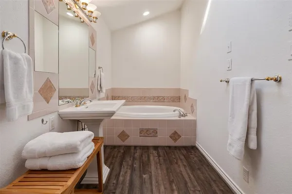 a bathroom with a sink and mirror