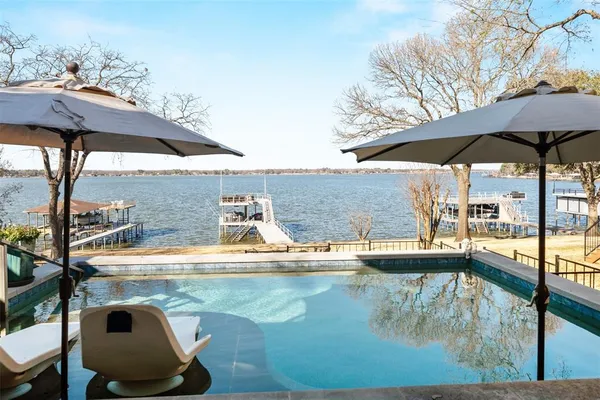a view of a swimming pool with a patio