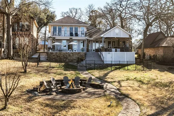 a front view of a house with a yard covered with snow in front of it