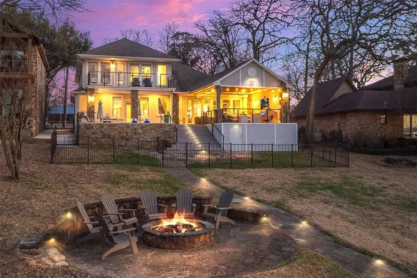 a view of a brick house with a yard