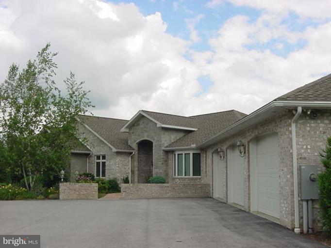 1133 Ragged Edge Road Chambersburg, PA 17202 - Photo 1 of 30 a front view of a house with a yard