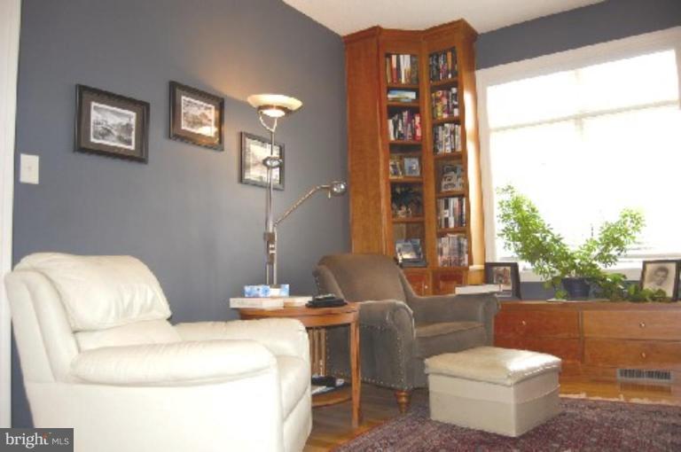 1133 Ragged Edge Road Chambersburg, PA 17202 - Photo 11 of 30 a living room with furniture a bed and a large window
