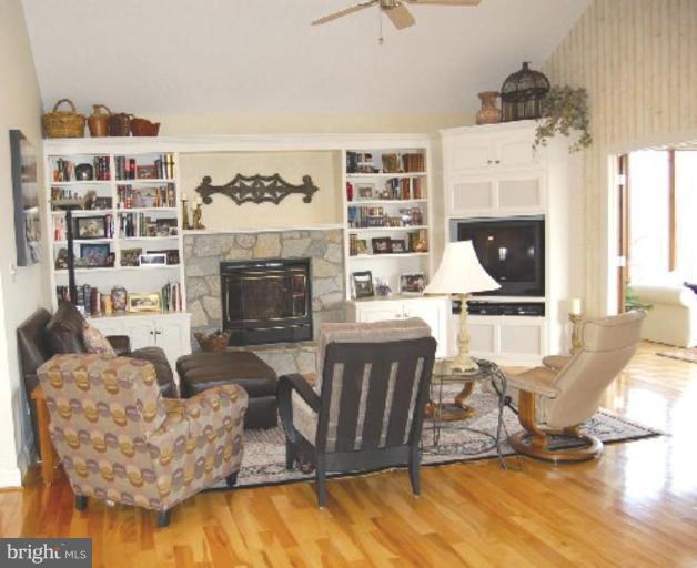 1133 Ragged Edge Road Chambersburg, PA 17202 - Photo 12 of 30 a living room with furniture and a fireplace