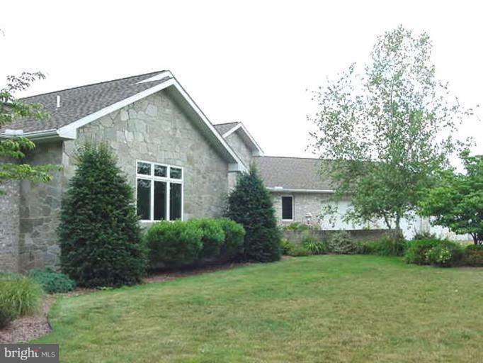 1133 Ragged Edge Road Chambersburg, PA 17202 - Photo 14 of 30 a view of backyard with a garden and plants